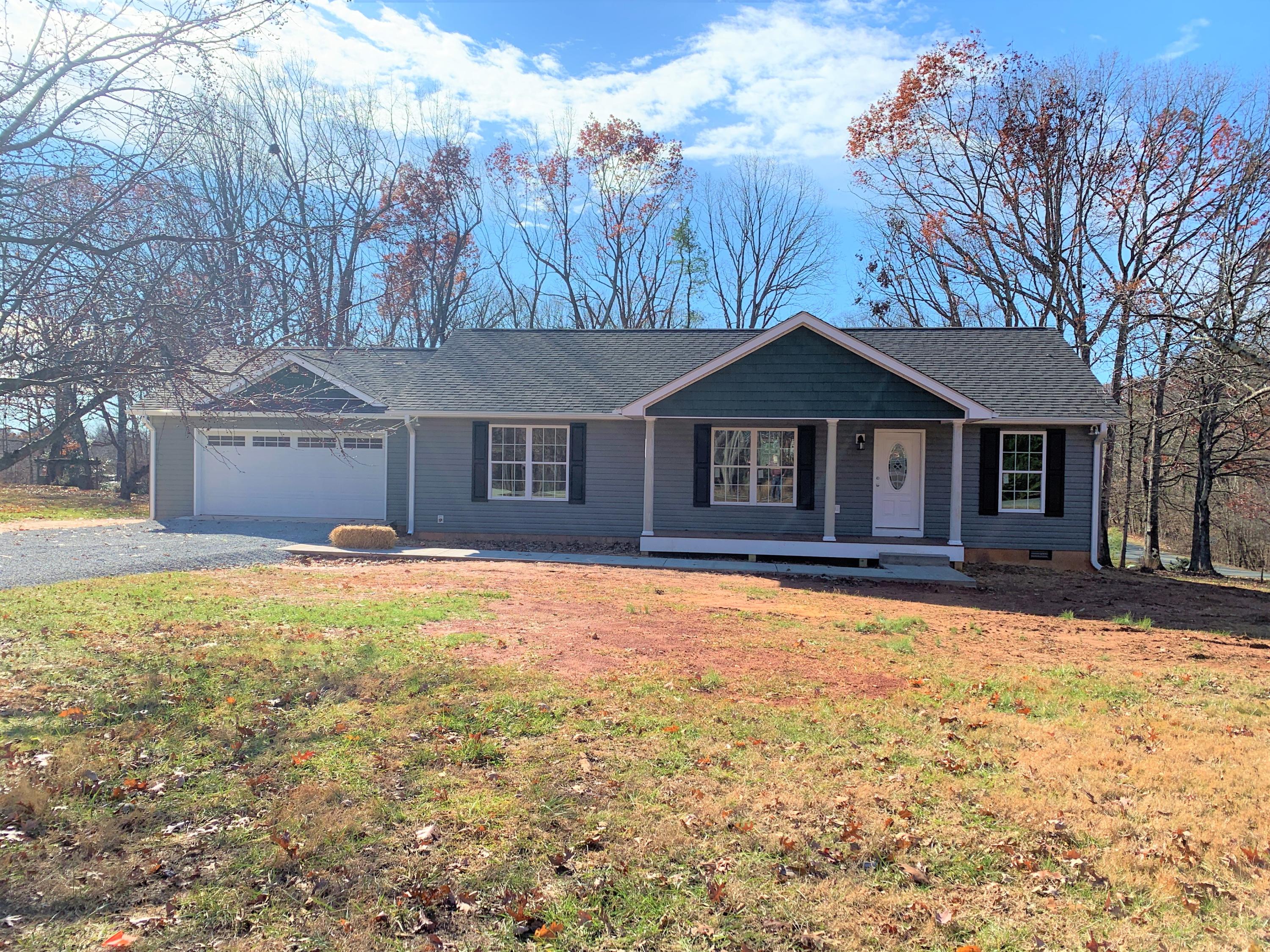 2731 Edwardsville Road Hardy, VA 24101 - Photo 21 of 45 a front view of a house with a yard and garage