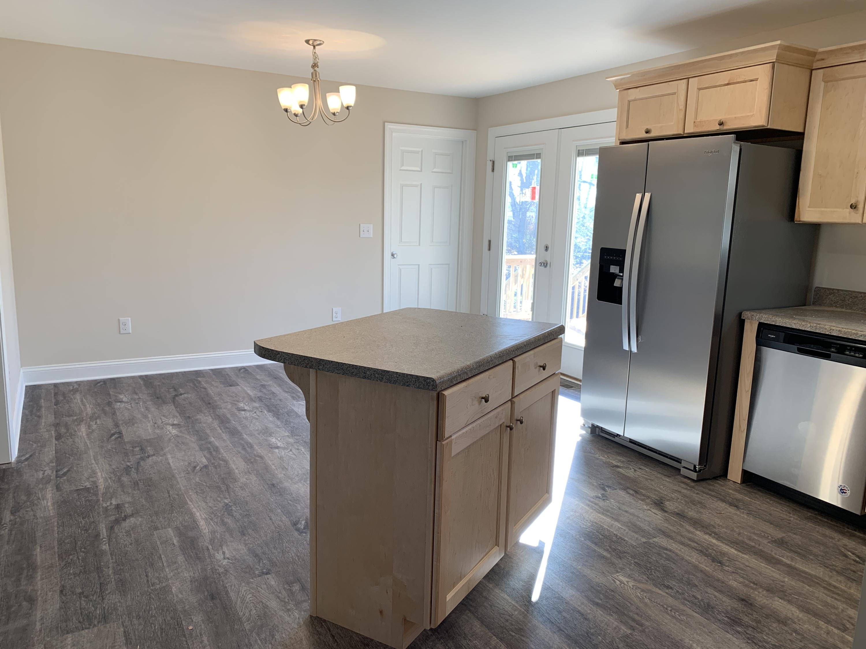 2731 Edwardsville Road Hardy, VA 24101 - Photo 27 of 45 a kitchen with granite countertop a refrigerator and a sink