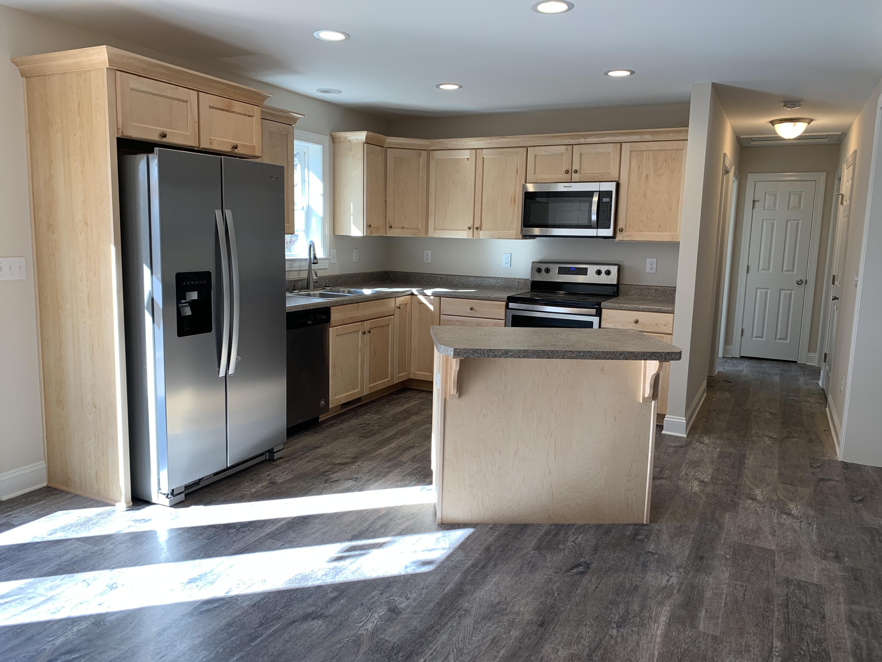 2731 Edwardsville Road Hardy, VA 24101 - Photo 4 of 45 a kitchen with granite countertop a refrigerator stove and microwave