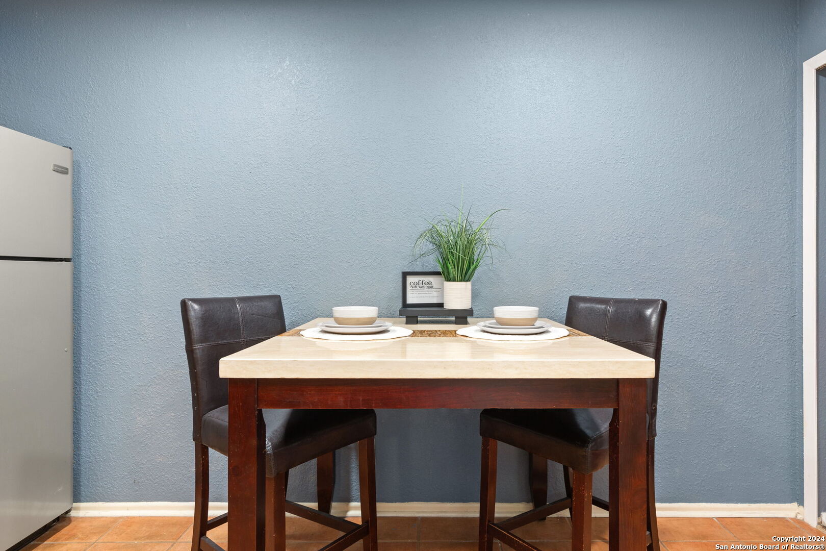 11520 Huebner Road, Unit 102 San Antonio, TX 78230 - Photo 7 of 15 a dining room with a table and chairs
