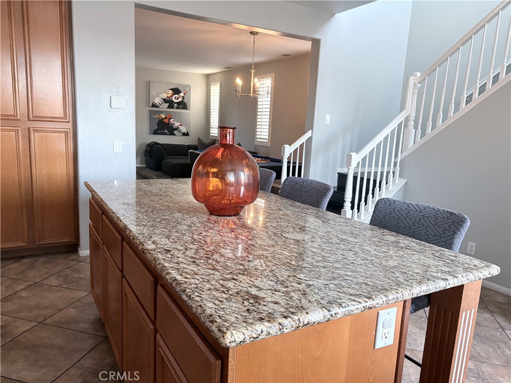 2729 Hornbeam Road Palmdale, CA 93551 - Photo 12 of 35 a view of kitchen island and living room
