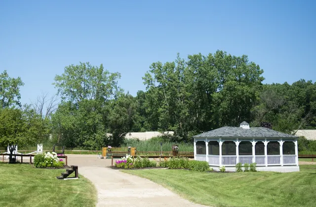 a view of a park with swings and slides