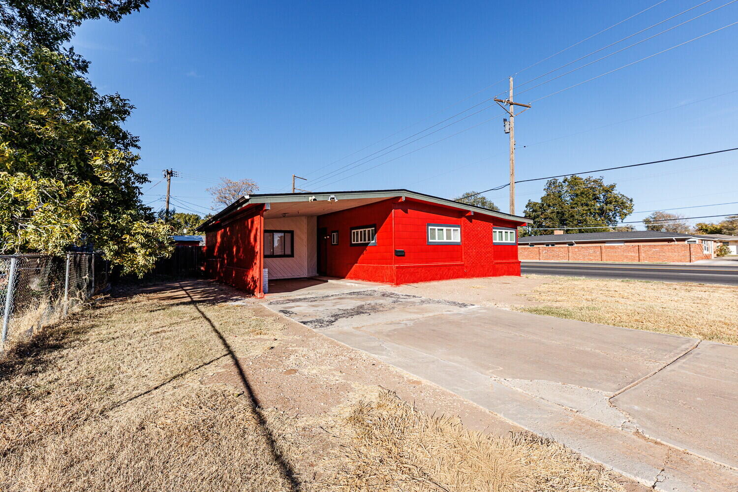 4402 44th Street Lubbock, TX 79414 - Photo 1 of 34 a front view of a building with retail shops