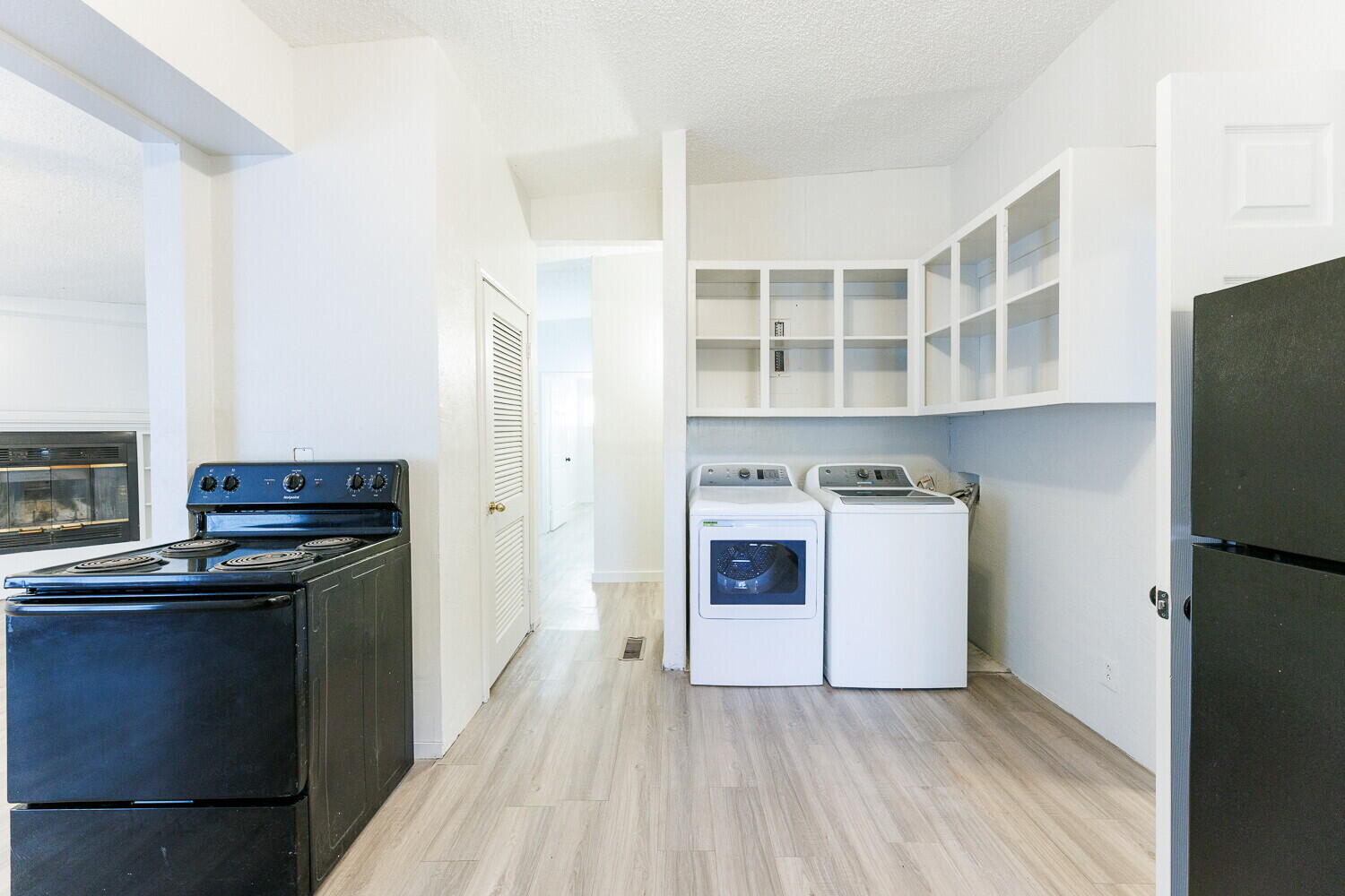 4402 44th Street Lubbock, TX 79414 - Photo 11 of 34 a kitchen with a stove and a refrigerator