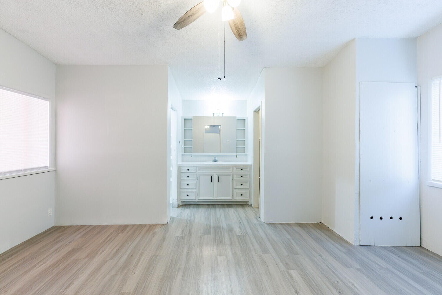 4402 44th Street Lubbock, TX 79414 - Photo 13 of 34 wooden floor in an empty room with a window