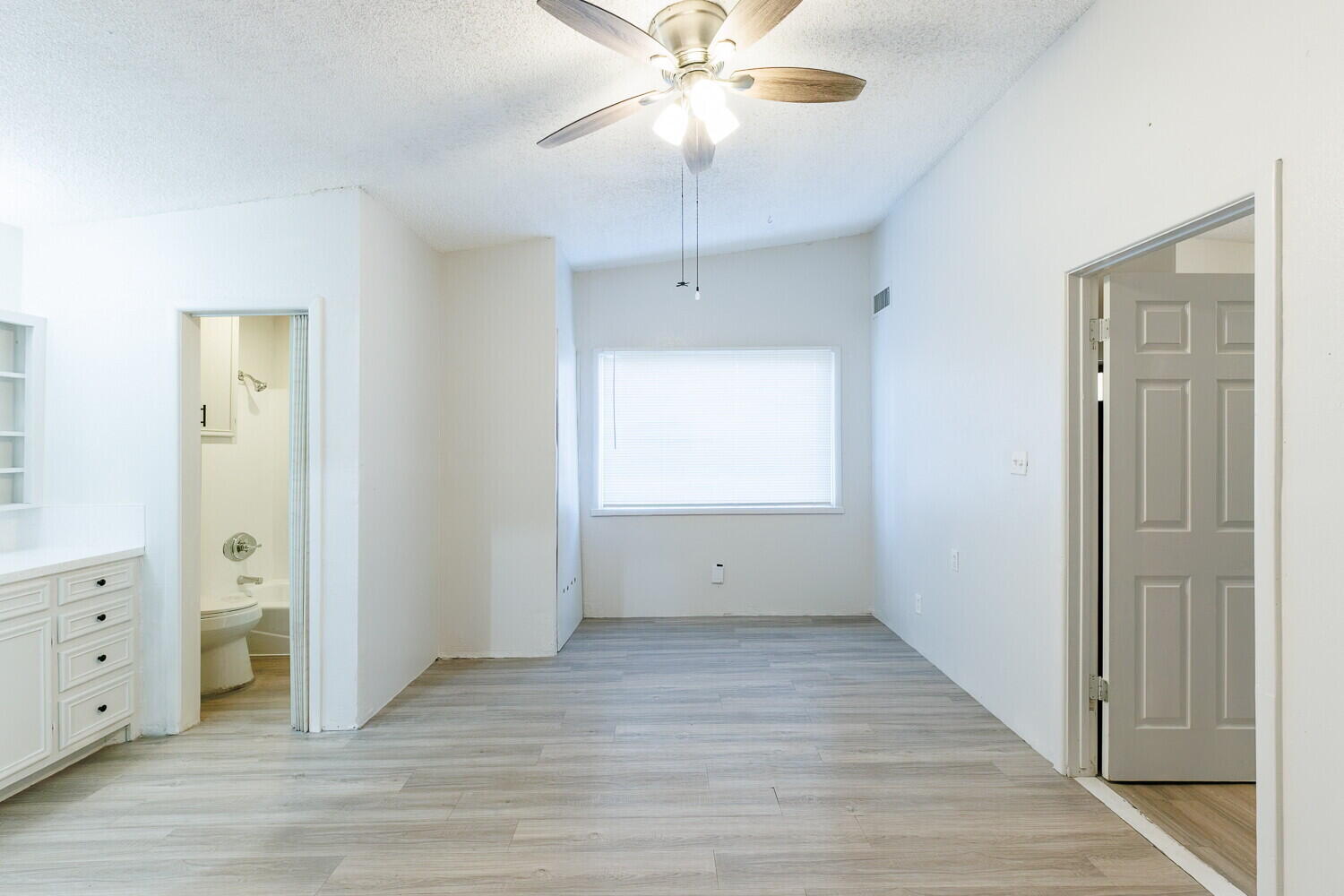 4402 44th Street Lubbock, TX 79414 - Photo 15 of 34 wooden floor in an empty room with a window