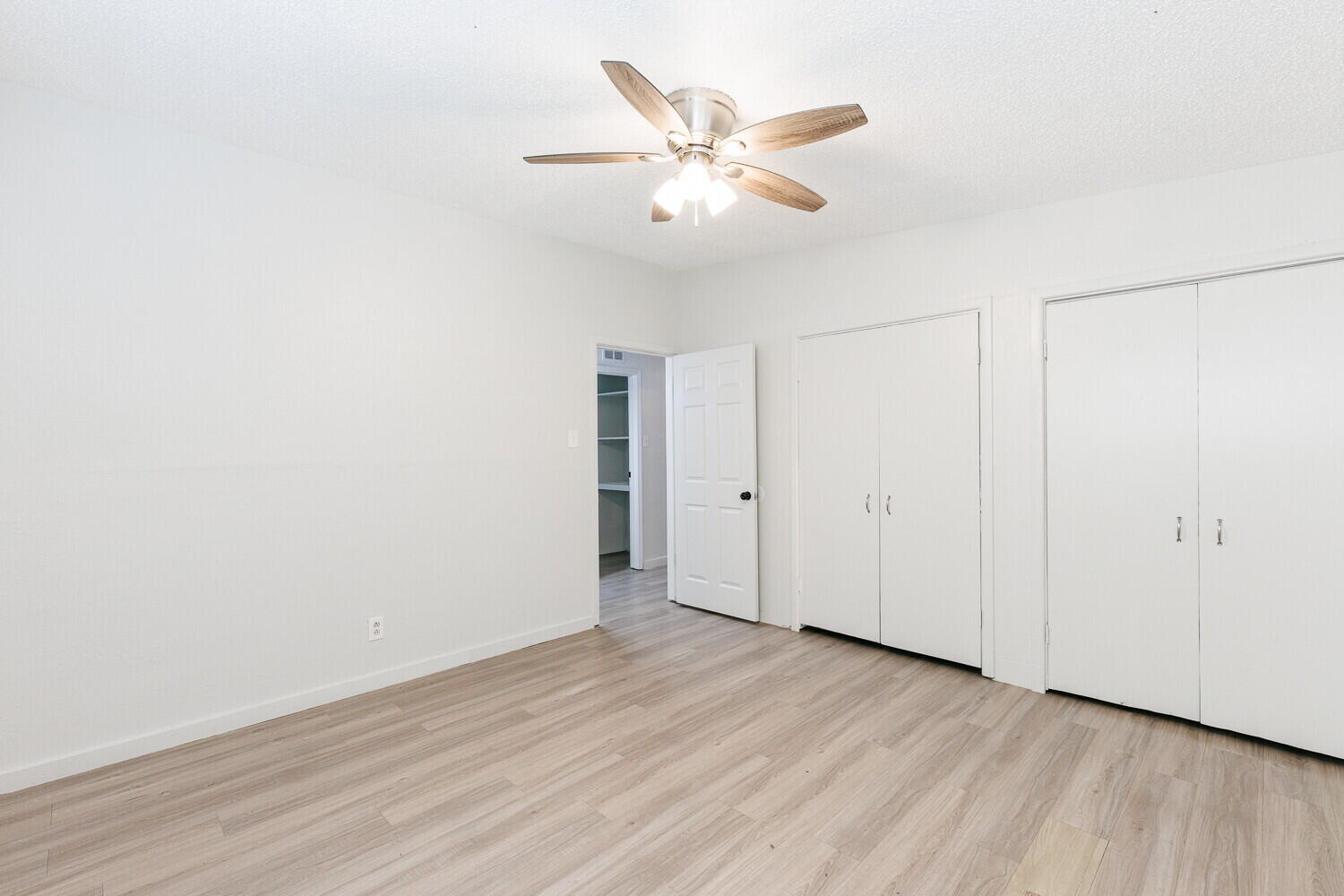 4402 44th Street Lubbock, TX 79414 - Photo 21 of 34 a view of an empty room with wooden floor
