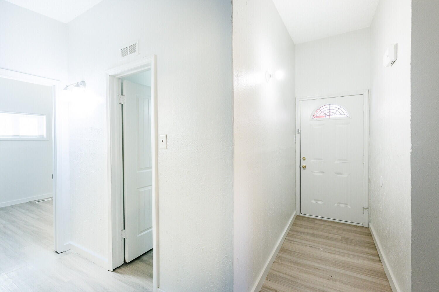 4402 44th Street Lubbock, TX 79414 - Photo 5 of 34 a view of a hallway with wooden floor