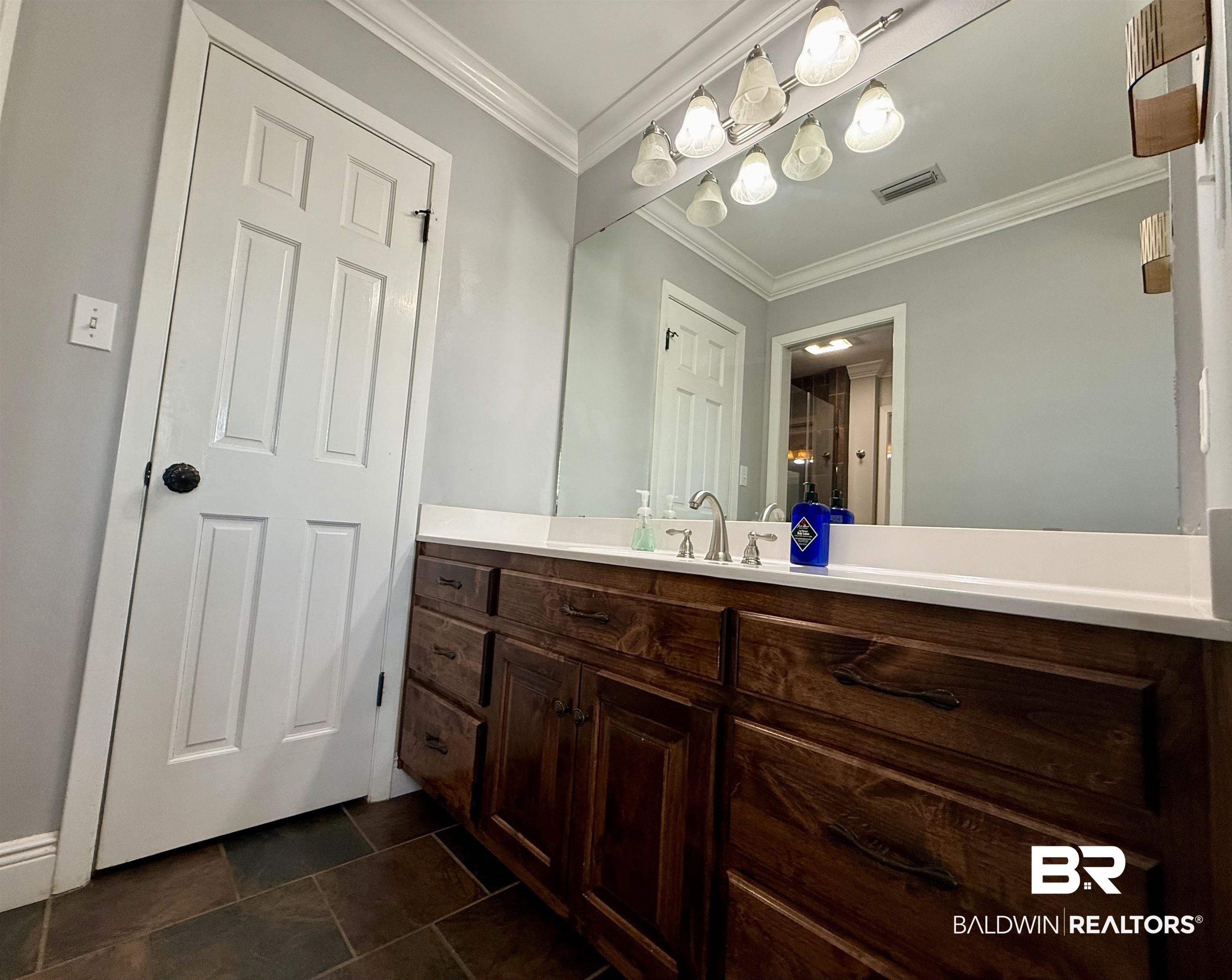 5646 Foshee Road Brewton, AL 36426 - Photo 16 of 37 Bathroom featuring vanity and crown molding