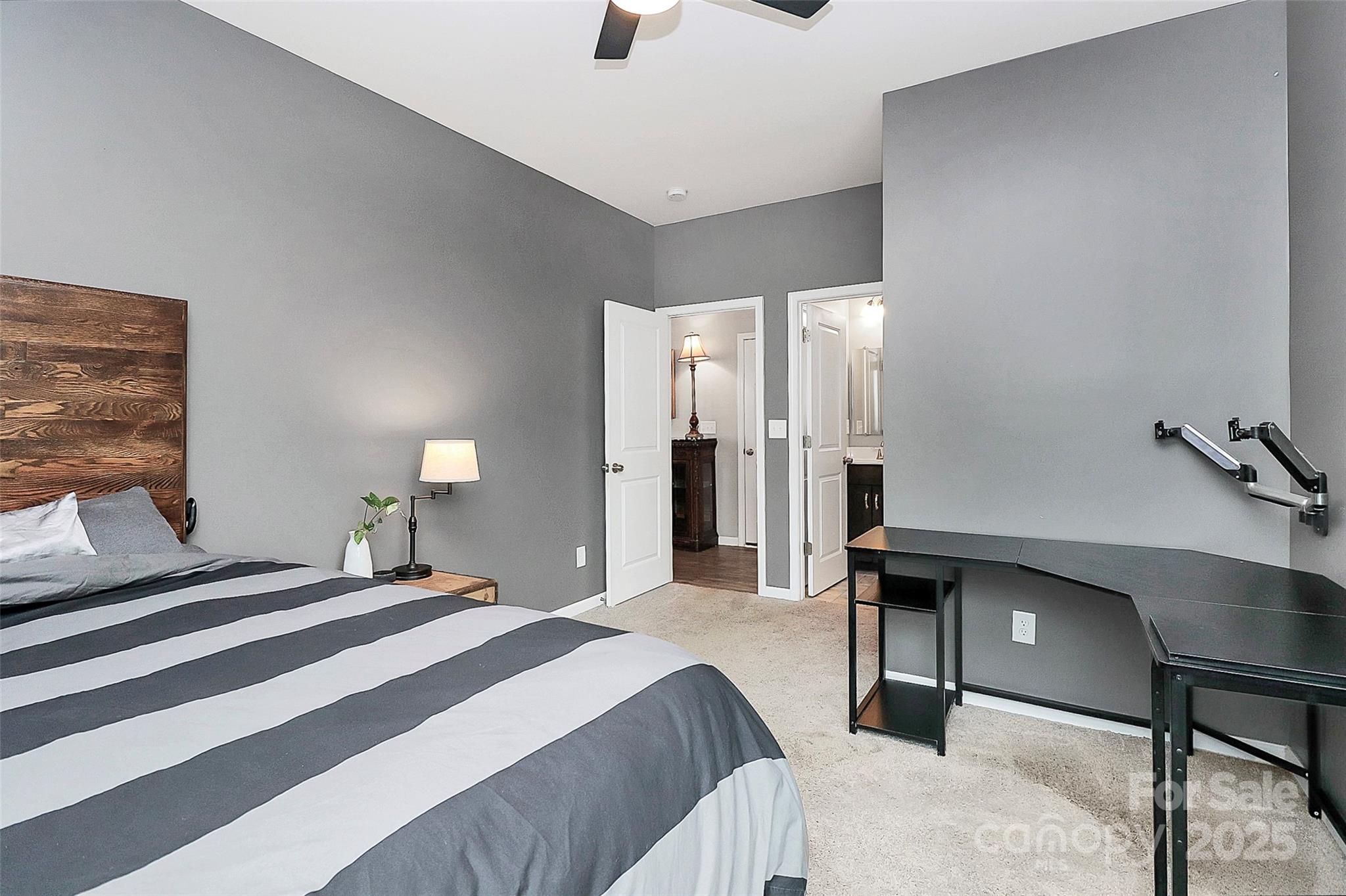 1093 Baldwin Drive Lancaster, SC 29720 - Photo 20 of 42 a bedroom with a bed and a lamp with the dresser