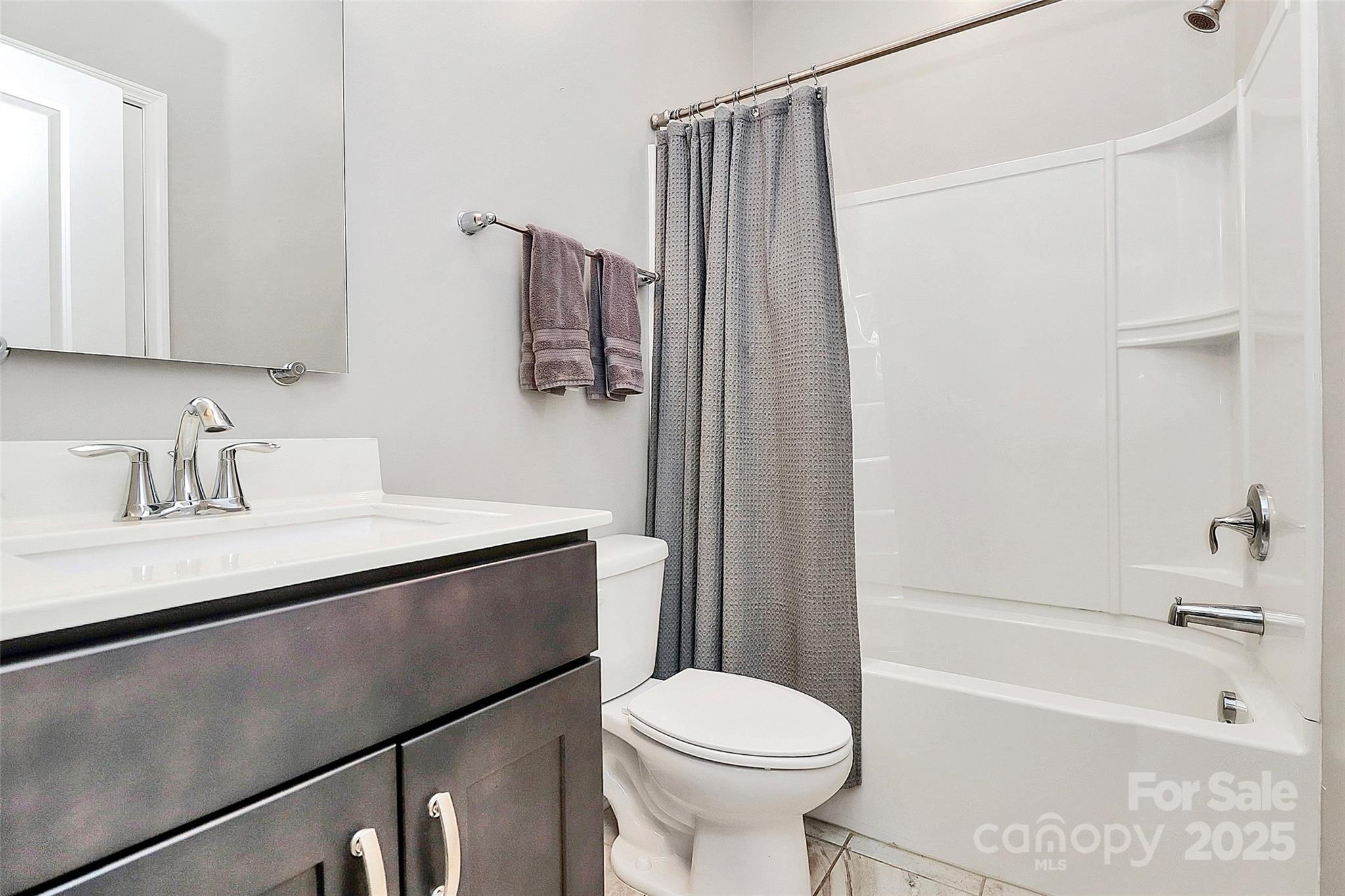 1093 Baldwin Drive Lancaster, SC 29720 - Photo 21 of 42 a bathroom with a sink a toilet and a bathtub