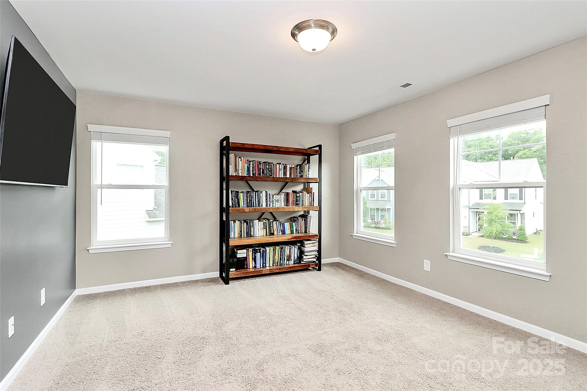 1093 Baldwin Drive Lancaster, SC 29720 - Photo 22 of 42 a big room with windows and closet