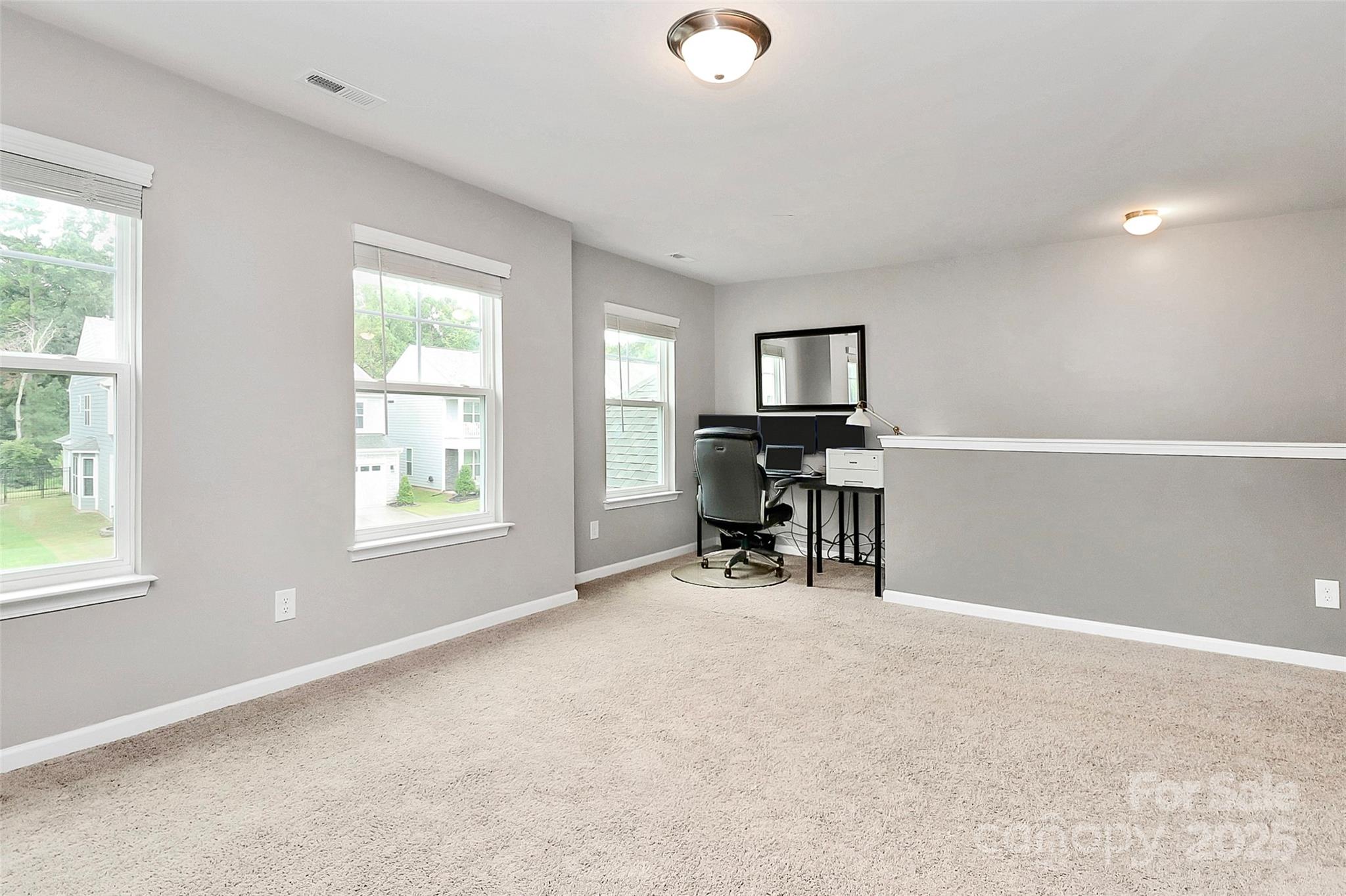 1093 Baldwin Drive Lancaster, SC 29720 - Photo 23 of 42 a view of a workspace with furniture and a window