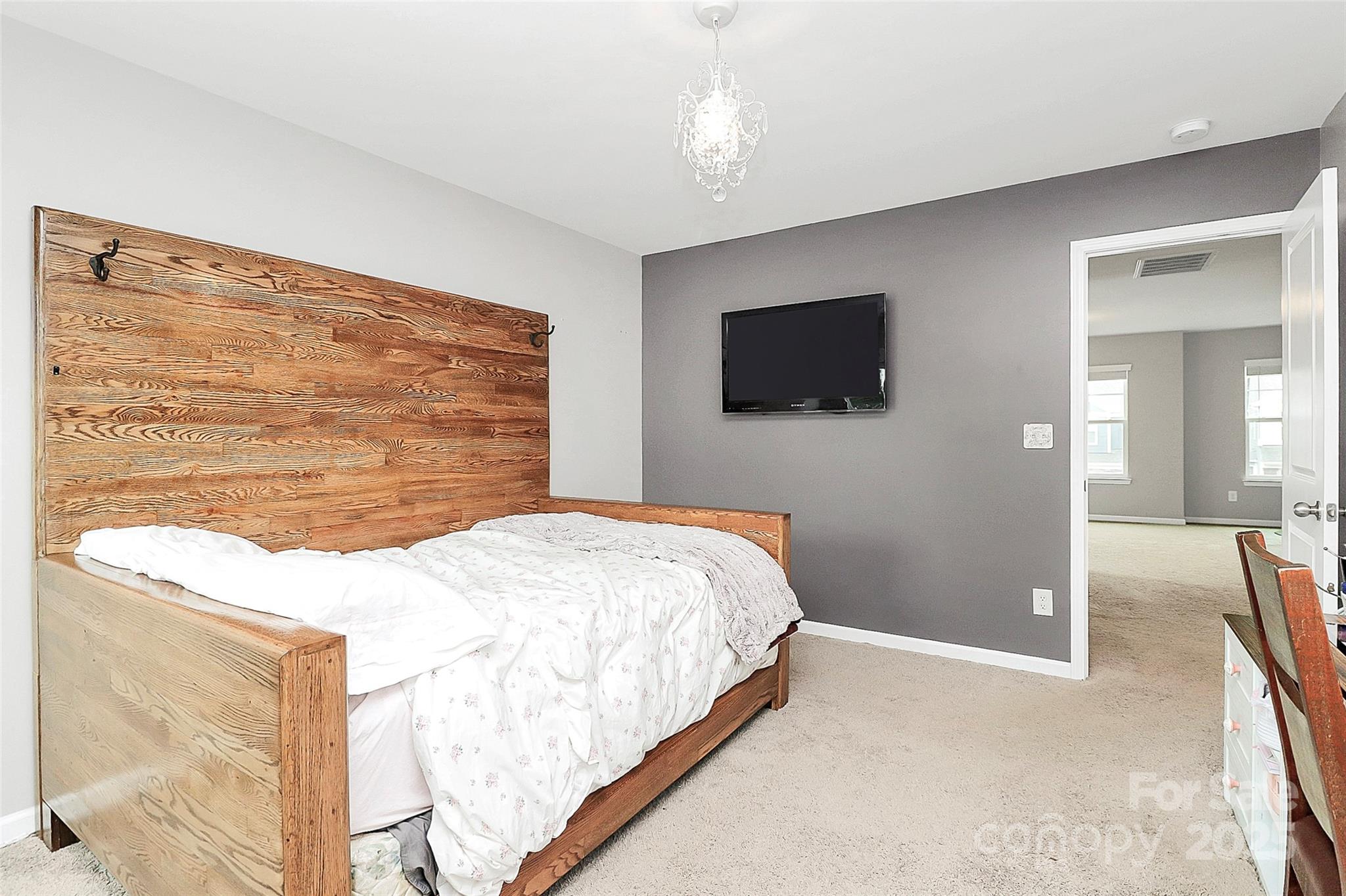 1093 Baldwin Drive Lancaster, SC 29720 - Photo 24 of 42 a bedroom with a bed and a flat screen tv