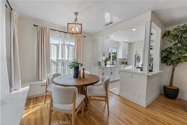 a view of a dining room with furniture and window