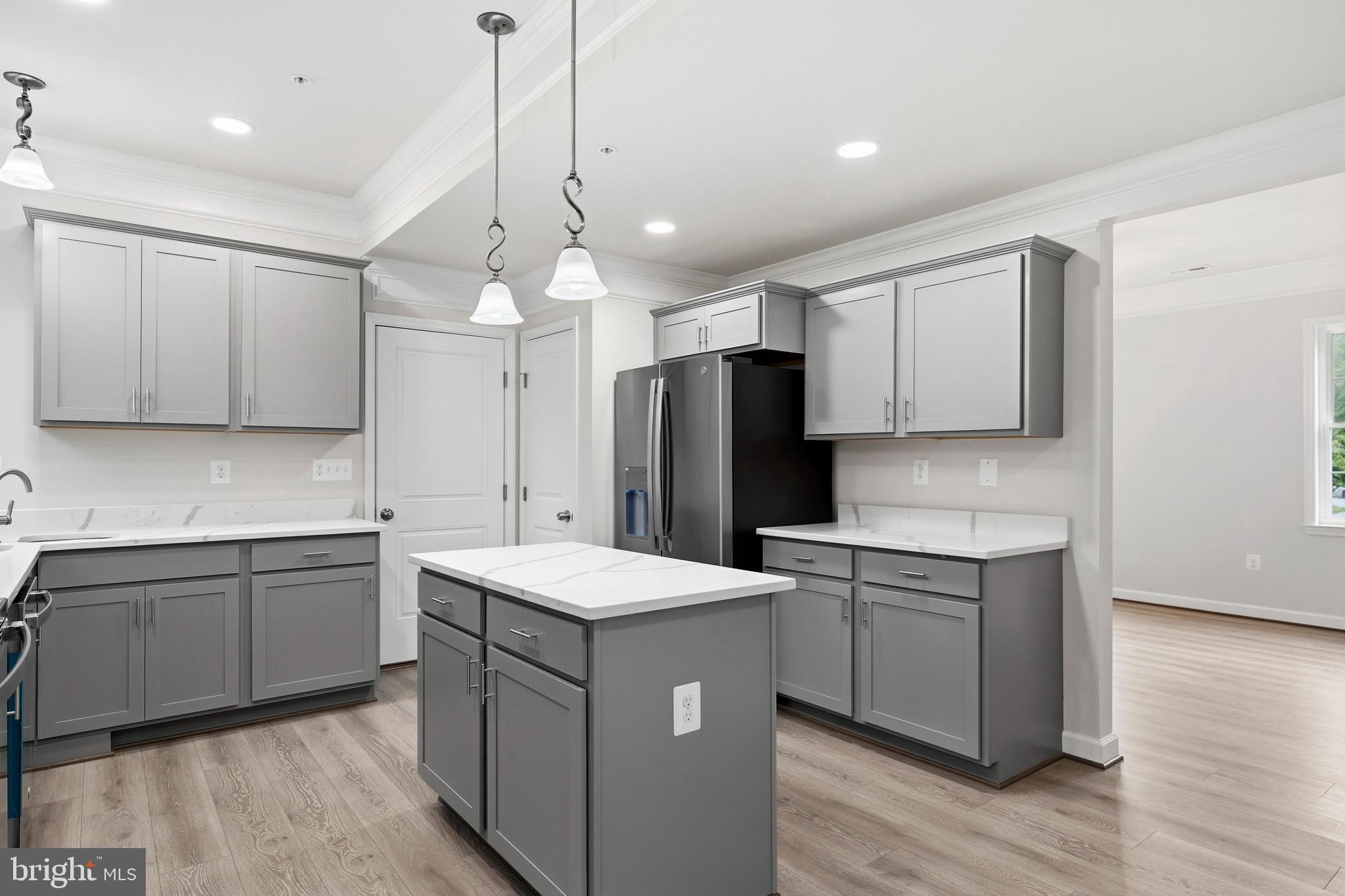 29725 Bruce Road Mechanicsville, MD 20659 - Photo 41 of 79 a kitchen with a sink a counter top space stainless steel appliances and cabinets