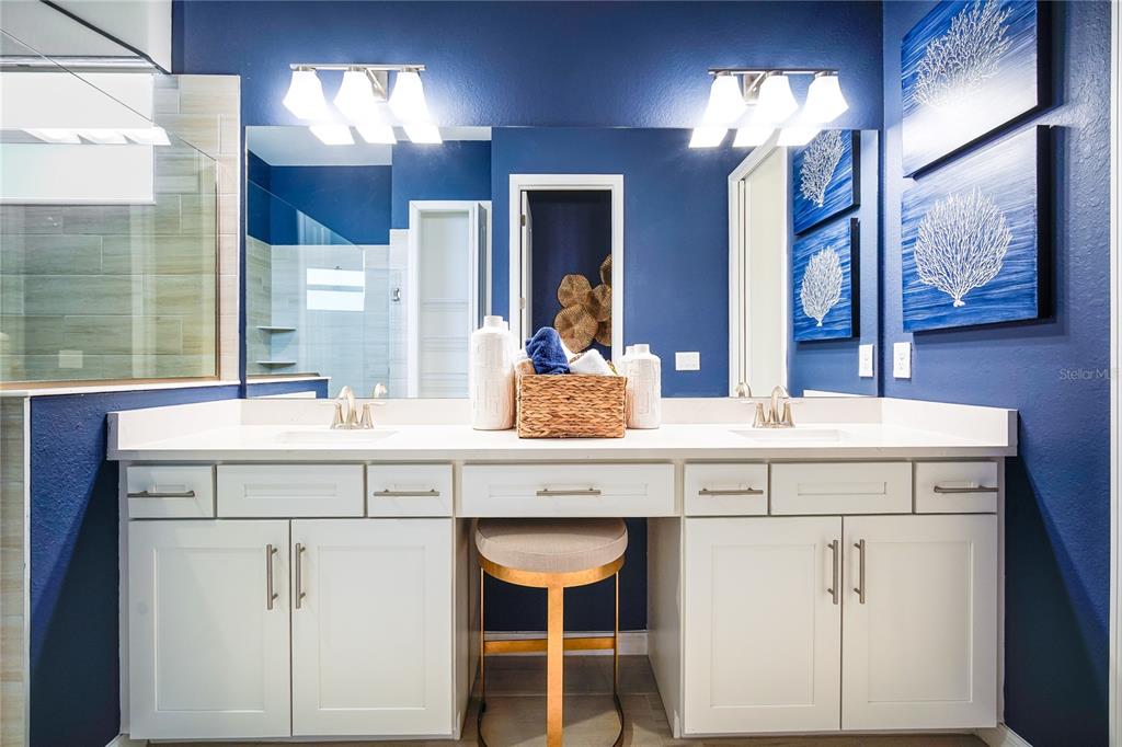 7165 Inlet Isles Lakewood Ranch, FL 34202 - Photo 19 of 26 a bathroom with a sink and a mirror