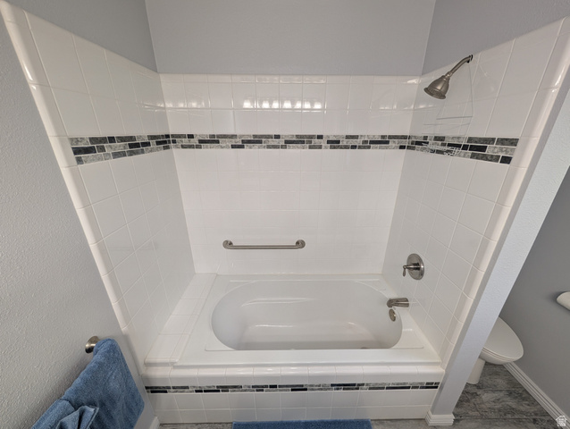 897 East 1200 North Mapleton, UT 84664 - Photo 33 of 54 Bathroom featuring toilet and bathing tub / shower combination