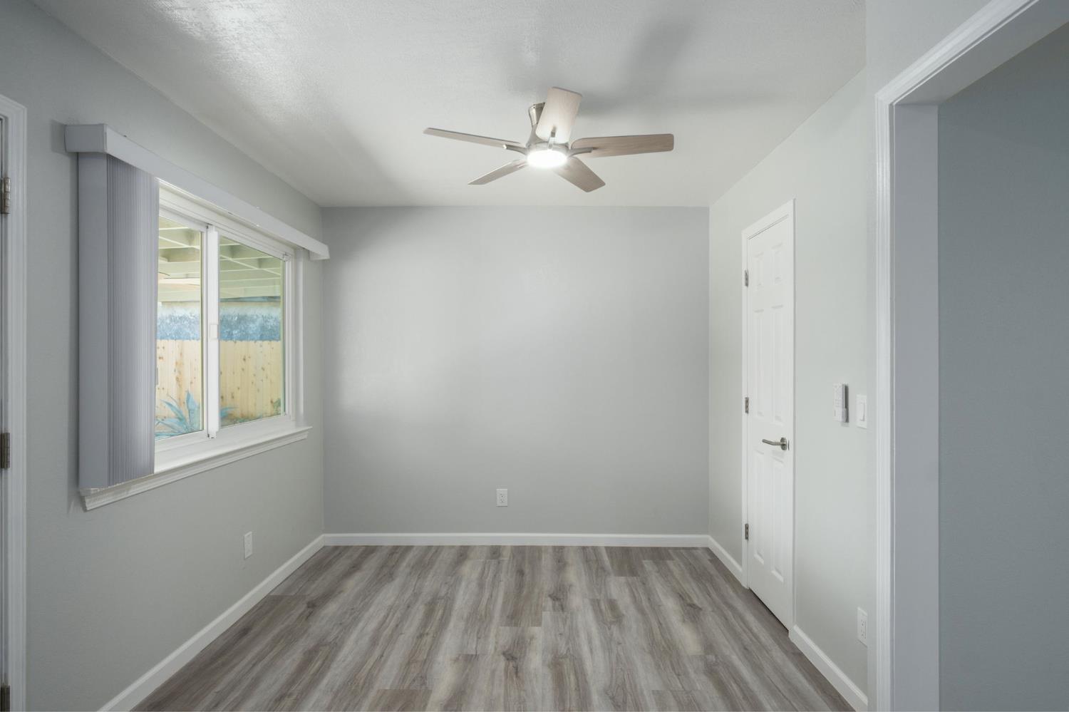 3062 Jasper Street Selma, CA 93662 - Photo 15 of 26 wooden floor in an empty room with a window
