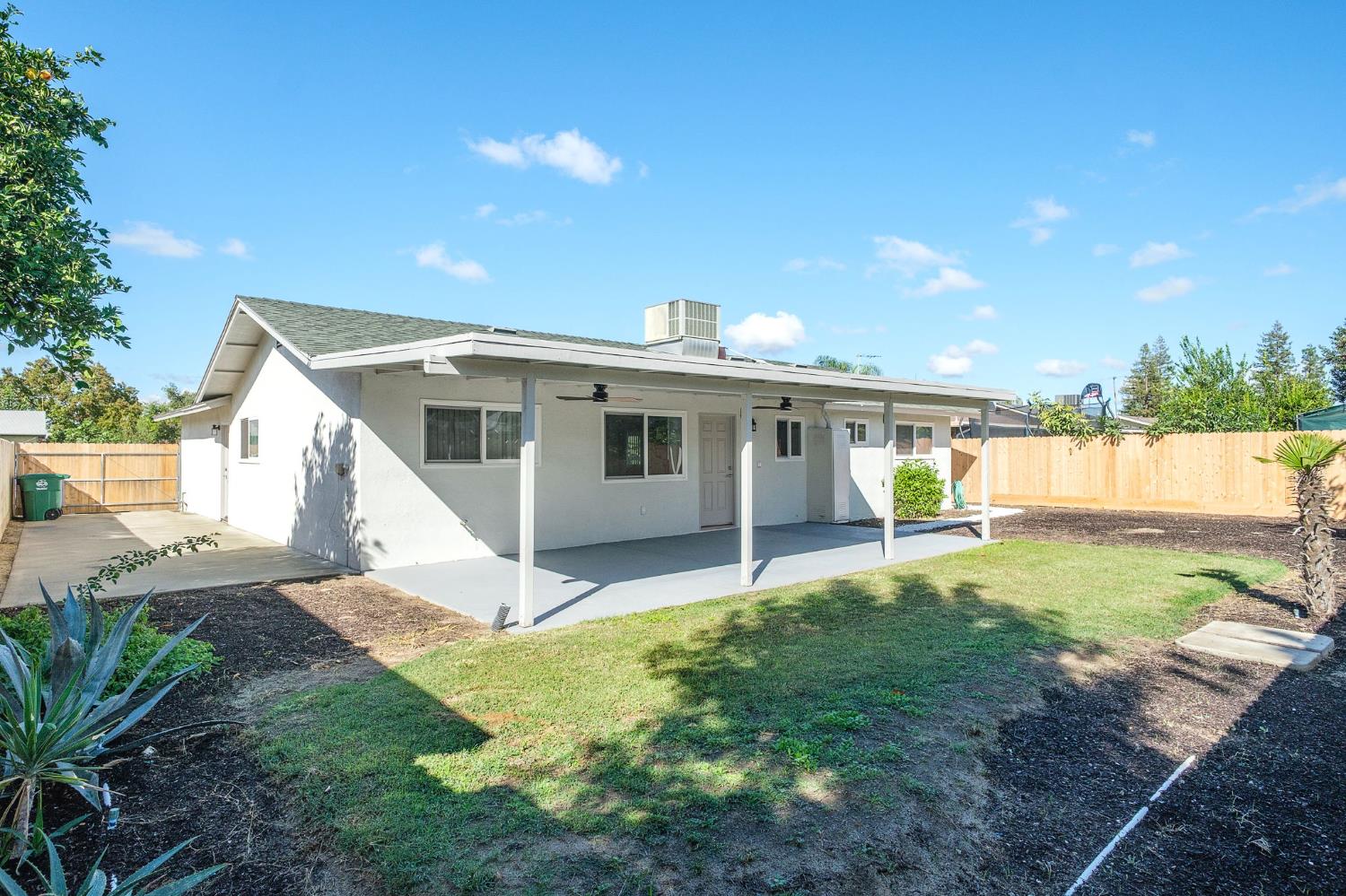 3062 Jasper Street Selma, CA 93662 - Photo 22 of 26 a view of a house with backyard and sitting area