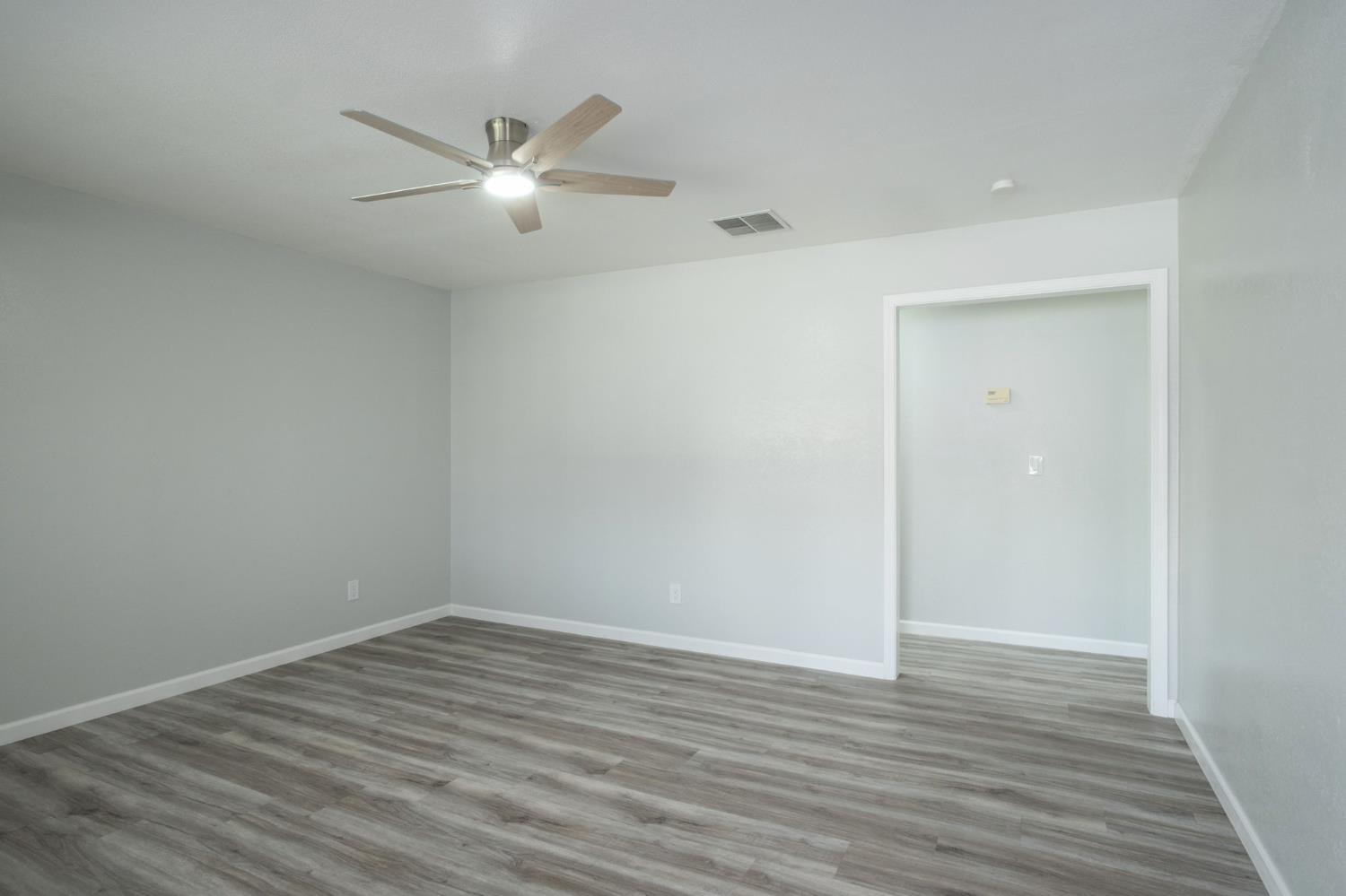 3062 Jasper Street Selma, CA 93662 - Photo 8 of 26 wooden floor in an empty room