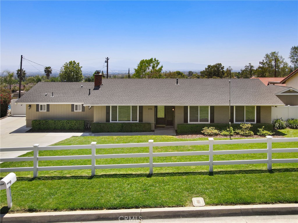 8729 Hillside Road Rancho Cucamonga, CA 91701 - Photo 1 of 66 a view of a big house with a big yard and plants