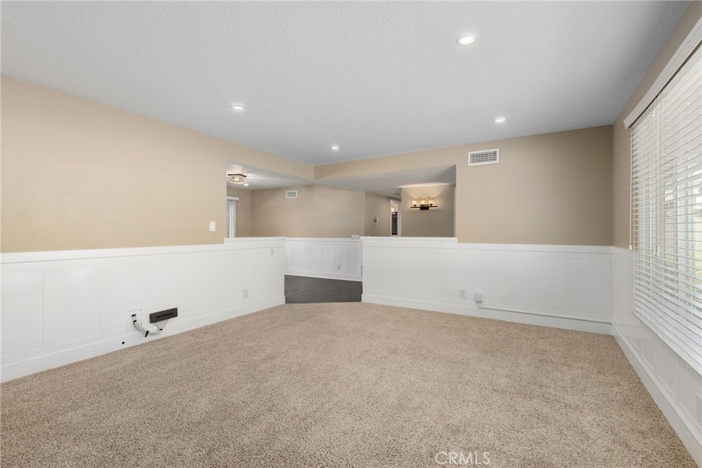 8729 Hillside Road Rancho Cucamonga, CA 91701 - Photo 11 of 66 a view of an empty room with a window