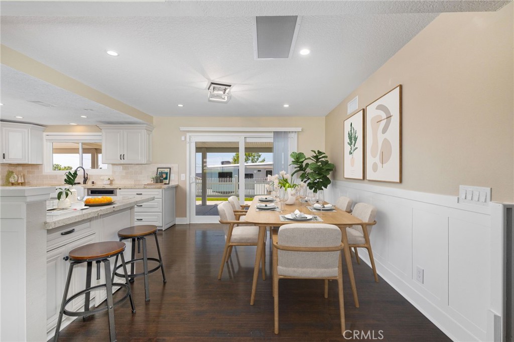 8729 Hillside Road Rancho Cucamonga, CA 91701 - Photo 13 of 66 a view of a dining room with furniture window and wooden floor