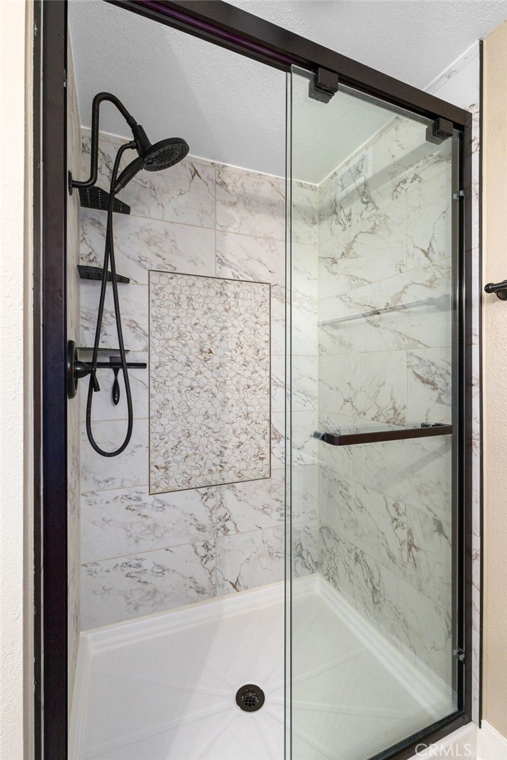 8729 Hillside Road Rancho Cucamonga, CA 91701 - Photo 33 of 66 a bathroom with a shower