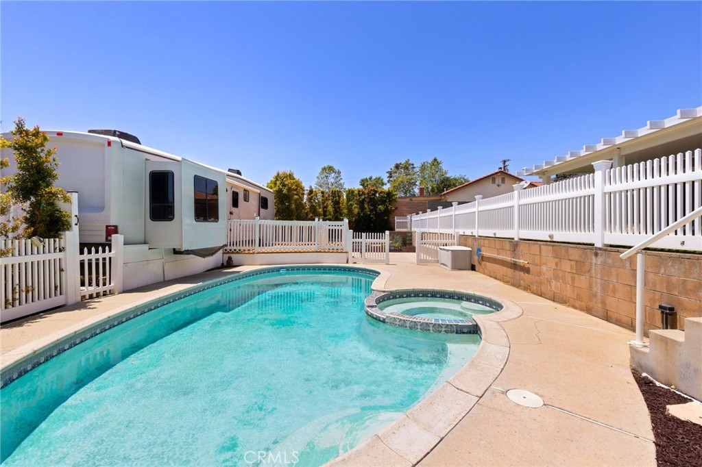 8729 Hillside Road Rancho Cucamonga, CA 91701 - Photo 48 of 66 a swimming pool with outdoor seating and yard