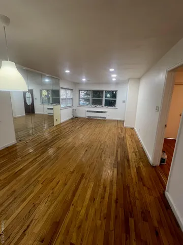a view of kitchen and wooden floor