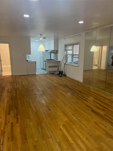 a view of an empty room and window