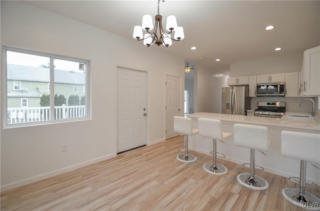 2 Elm Street Mount Pocono, PA 18344 - Photo 13 of 45 a view of a kitchen with granite countertop wooden floor and stainless steel appliances