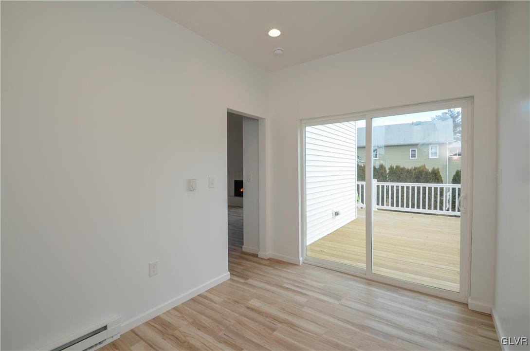 2 Elm Street Mount Pocono, PA 18344 - Photo 16 of 45 an empty room with wooden floor and windows
