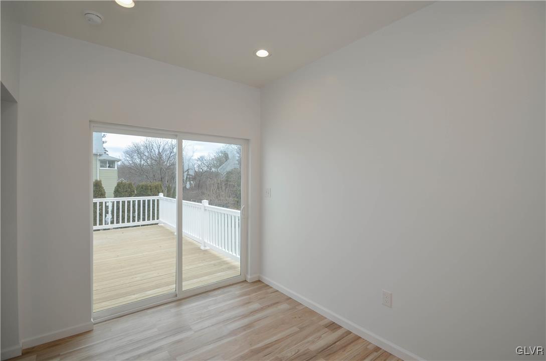 2 Elm Street Mount Pocono, PA 18344 - Photo 17 of 45 an empty room with wooden floor and windows