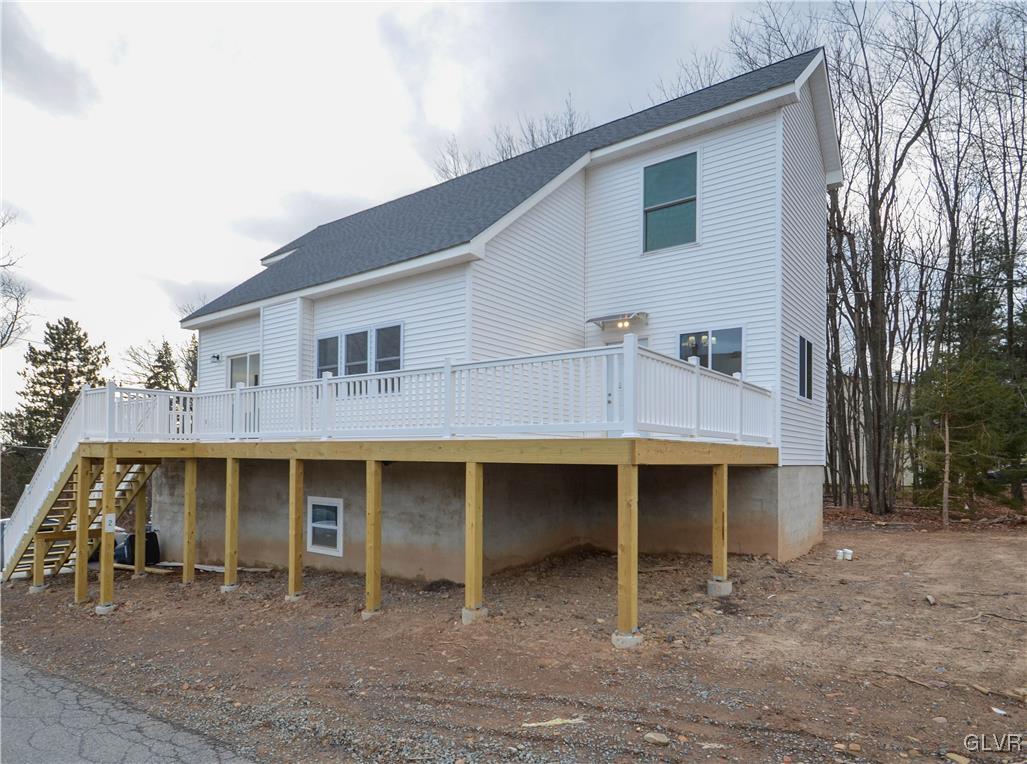 2 Elm Street Mount Pocono, PA 18344 - Photo 2 of 45 a front view of a house with a yard and garage