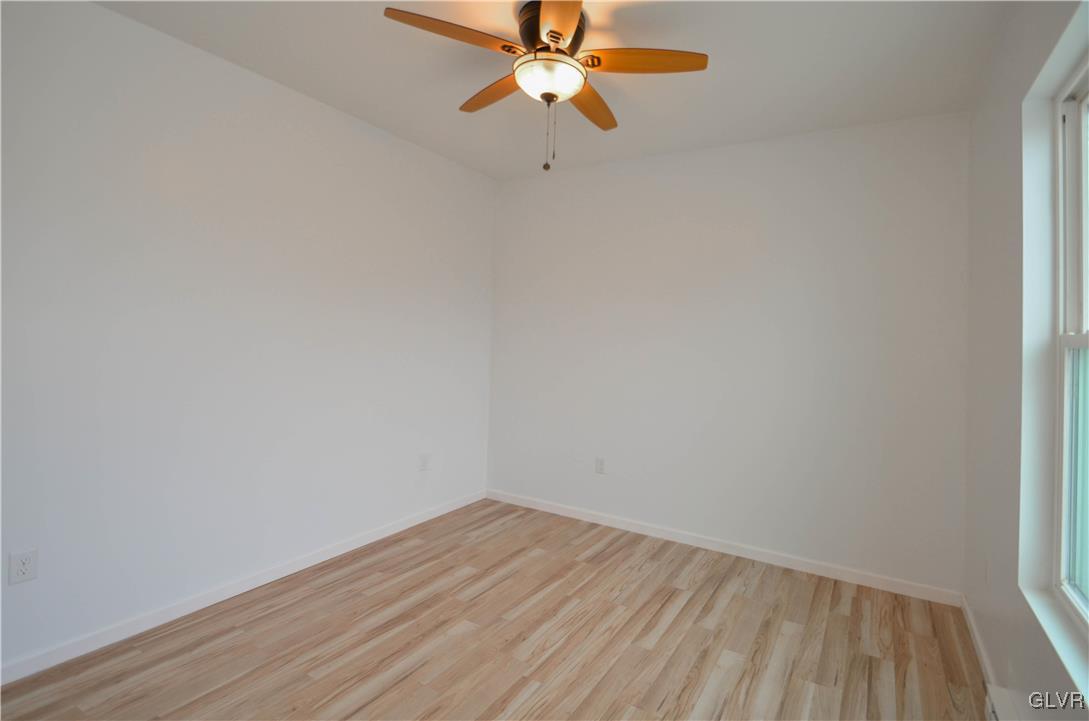 2 Elm Street Mount Pocono, PA 18344 - Photo 25 of 45 a view of a room with wooden floor a ceiling fan and window