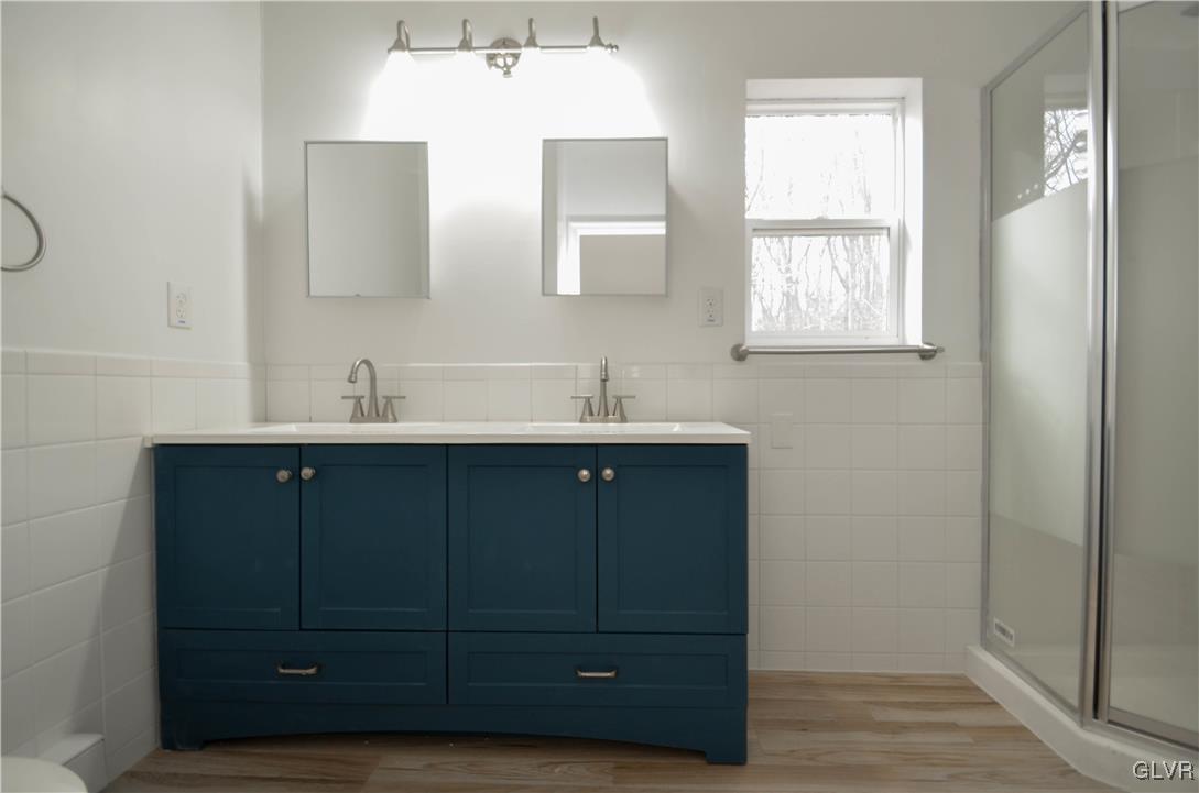 2 Elm Street Mount Pocono, PA 18344 - Photo 33 of 45 a bathroom with a sink vanity and mirror