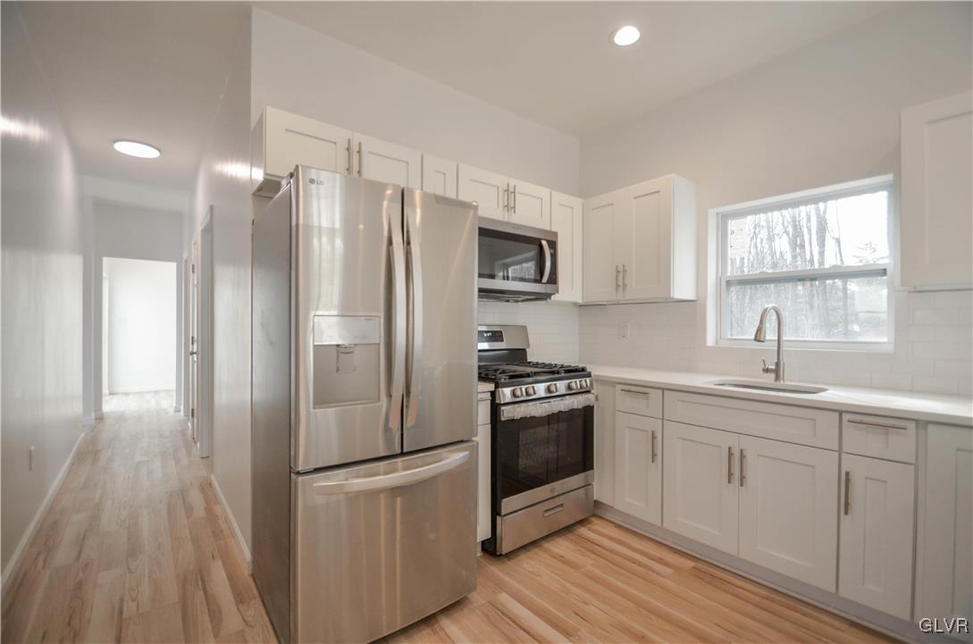 2 Elm Street Mount Pocono, PA 18344 - Photo 8 of 45 a kitchen with stainless steel appliances a refrigerator sink and microwave