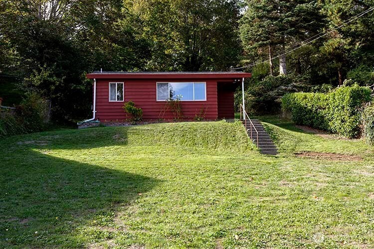 1357 Jacobsen Boulevard Bremerton, WA 98310 - Photo 1 of 7 a view of a house with a backyard