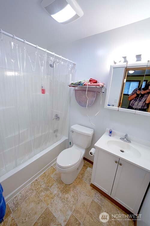 1357 Jacobsen Boulevard Bremerton, WA 98310 - Photo 6 of 7 a bathroom with a sink toilet and shower