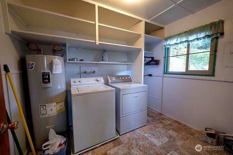 1357 Jacobsen Boulevard Bremerton, WA 98310 - Photo 7 of 7 a utility room with dryer and washer