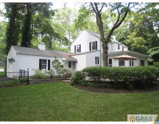 58 Pennington Road New Brunswick, NJ 08901 - Photo 3 of 10 a front view of a house with a garden and yard