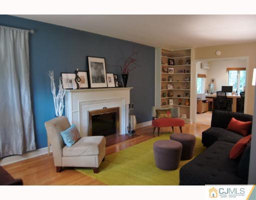 58 Pennington Road New Brunswick, NJ 08901 - Photo 5 of 10 a living room with furniture and a fireplace