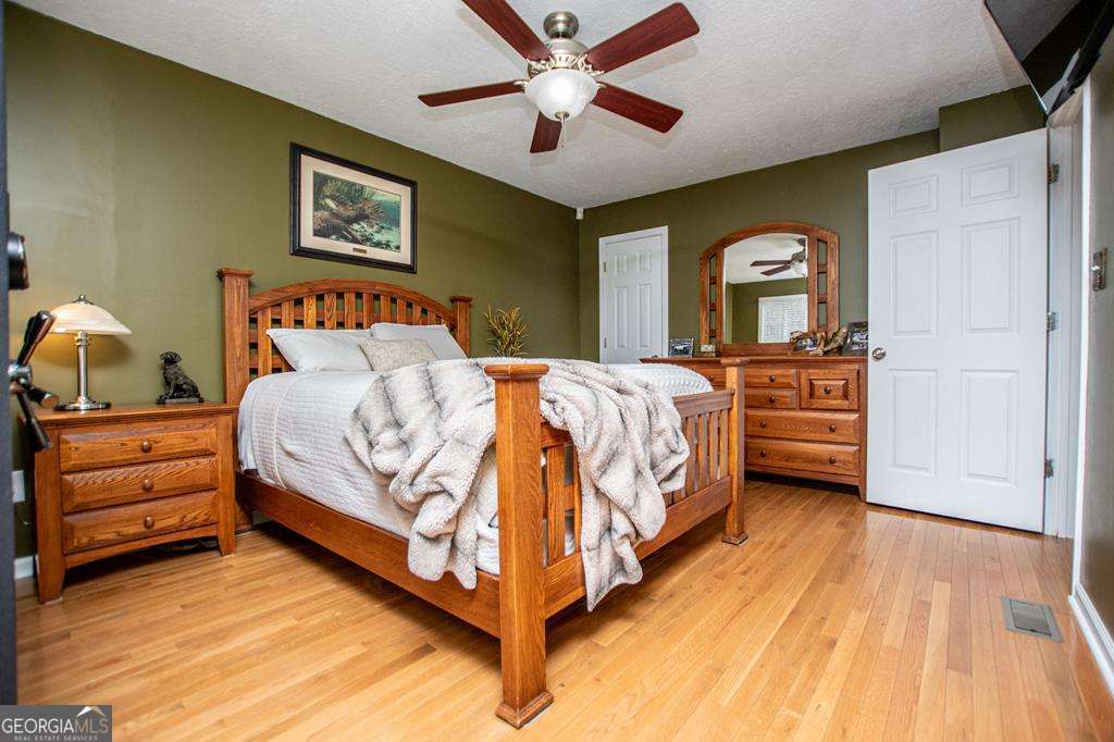 2 Pine Hill Drive Ranburne, AL 36273 - Photo 39 of 91 a bedroom with a bed and a dresser