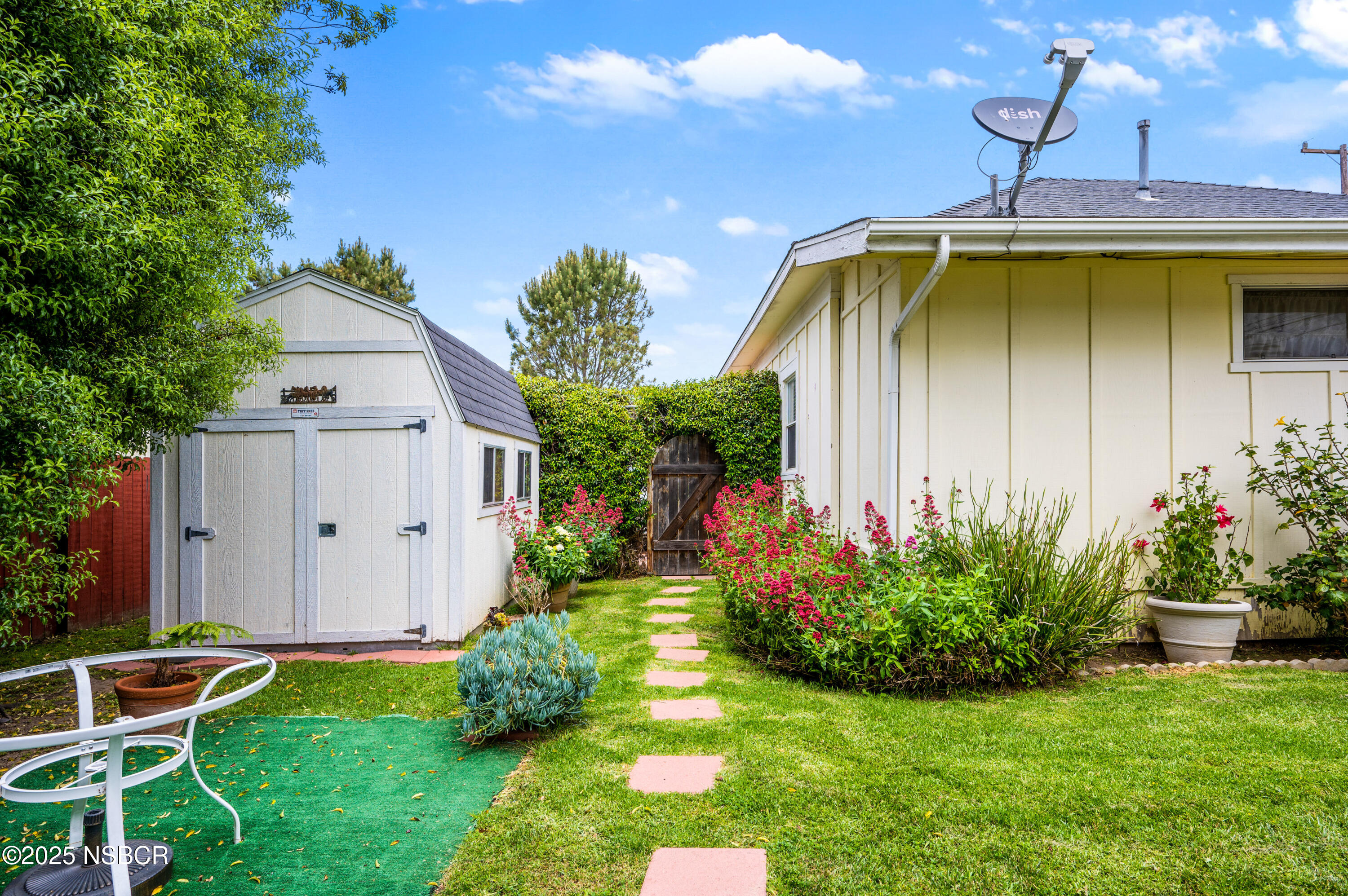 414 West Walnut Avenue Lompoc, CA 93436 - Photo 11 of 17 a front view of a house with garden