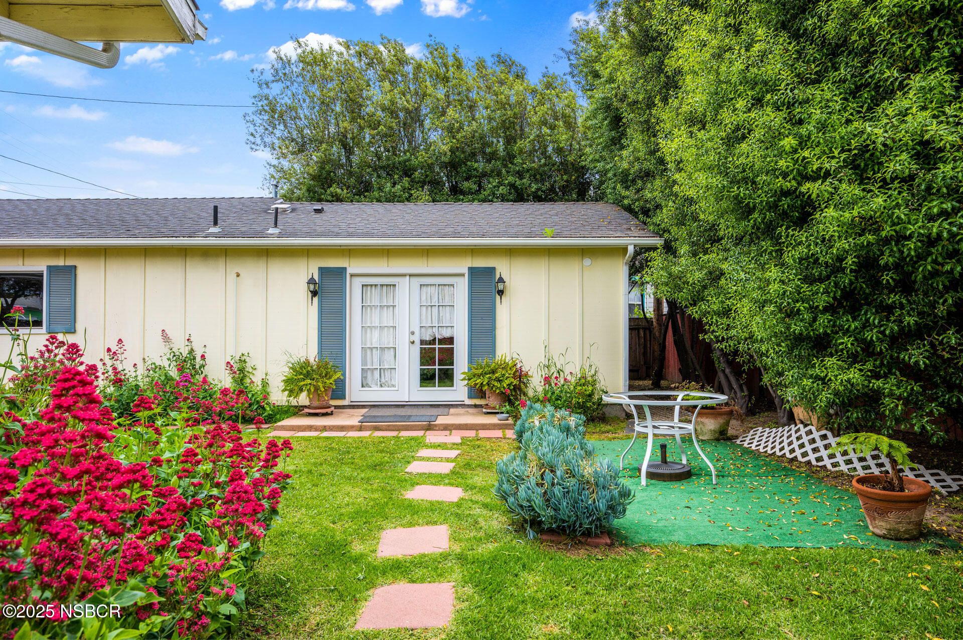414 West Walnut Avenue Lompoc, CA 93436 - Photo 13 of 17 a front view of a house with garden
