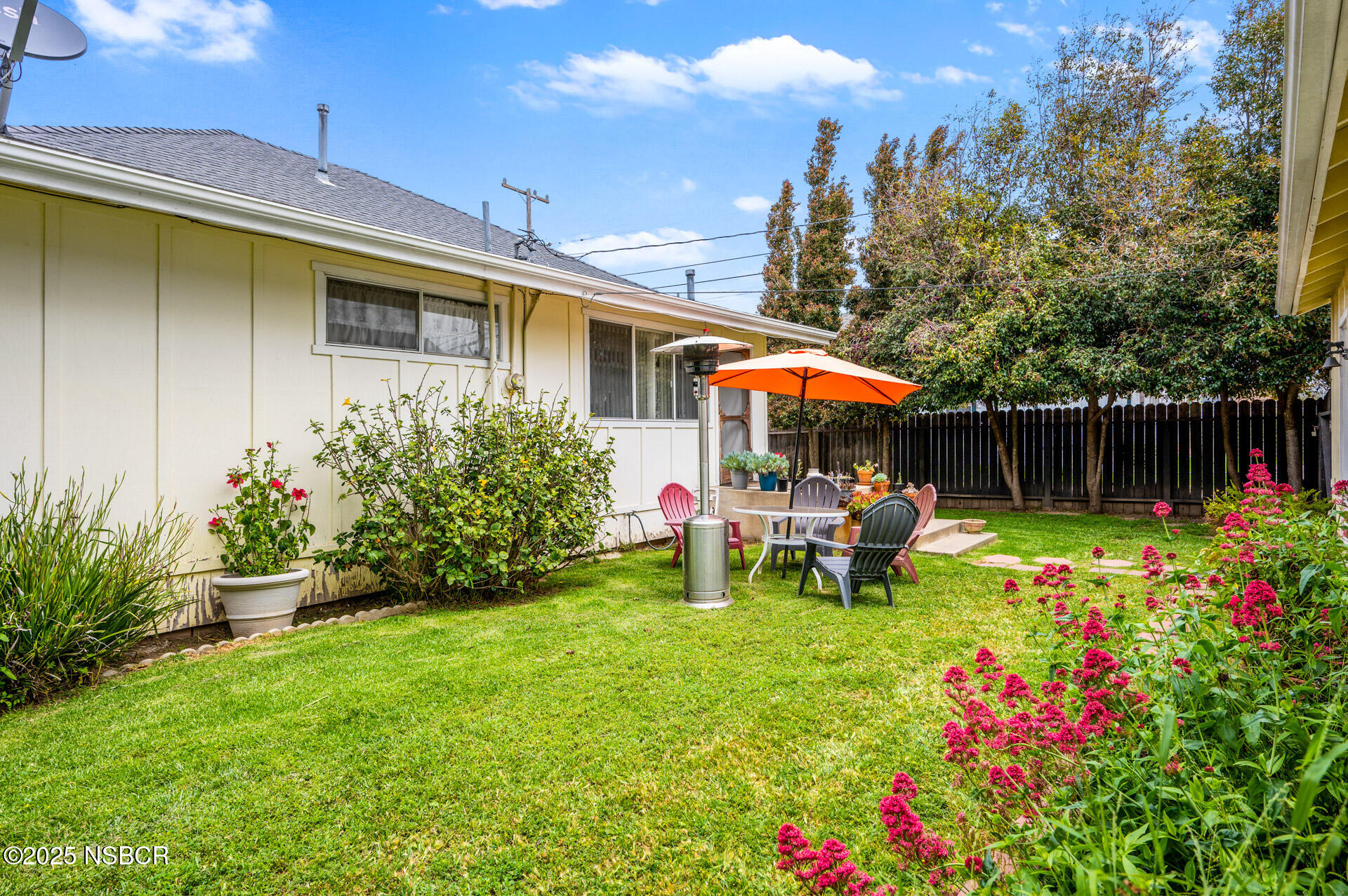 414 West Walnut Avenue Lompoc, CA 93436 - Photo 15 of 17 a view of a chair and table in backyard of the house