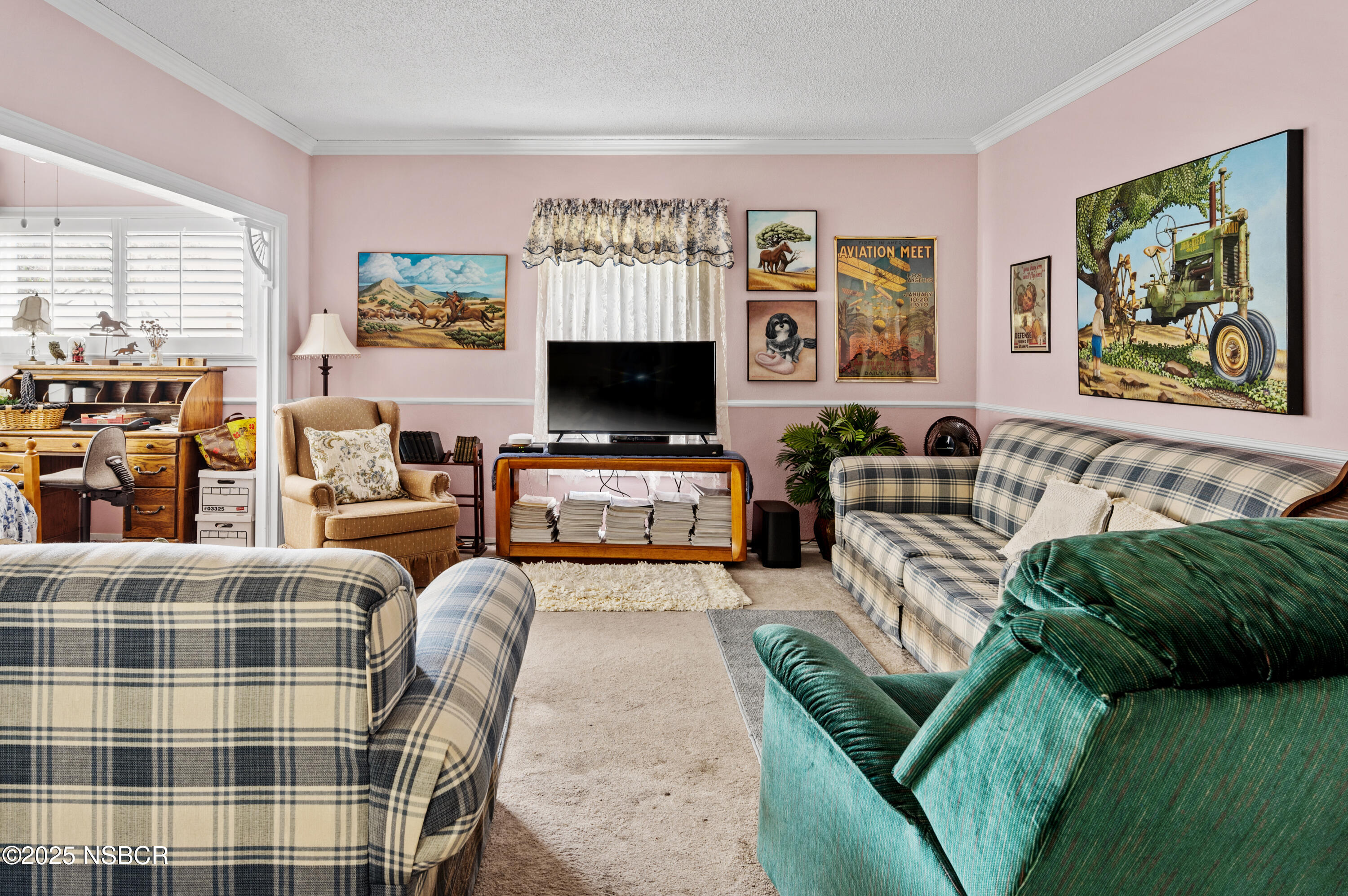 414 West Walnut Avenue Lompoc, CA 93436 - Photo 4 of 17 a living room with furniture a flat screen tv and a fireplace