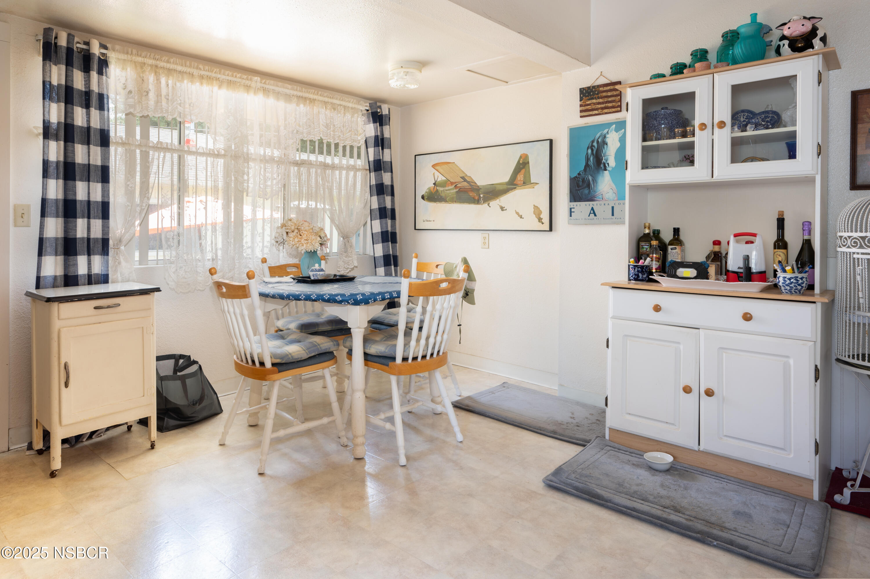 414 West Walnut Avenue Lompoc, CA 93436 - Photo 6 of 17 a view of a workspace with furniture and a window